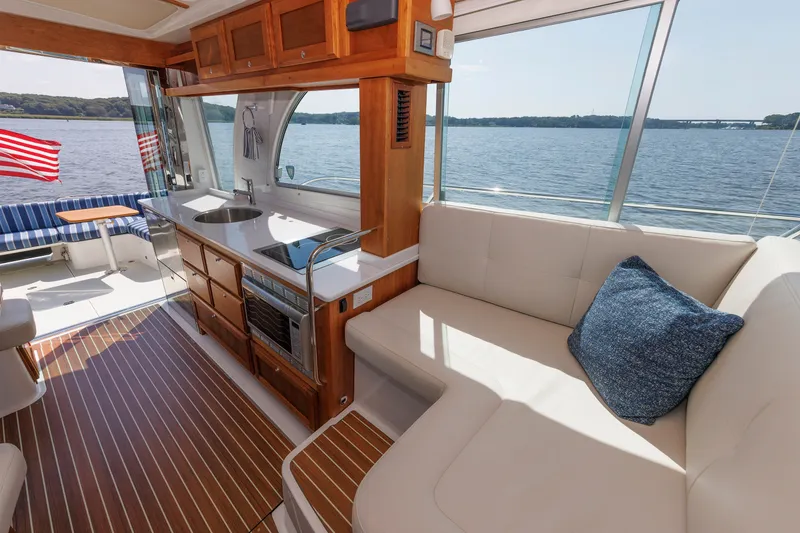 Slide: The Image of Luxurious interior of 2020 Back Cove 41 yacht with elegant seating and kitchenette. - 12