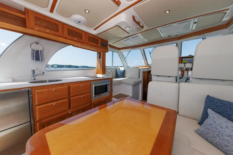 Slide: The Image of Luxurious interior of 2020 Back Cove 41 yacht with modern kitchen and seating area. - 8