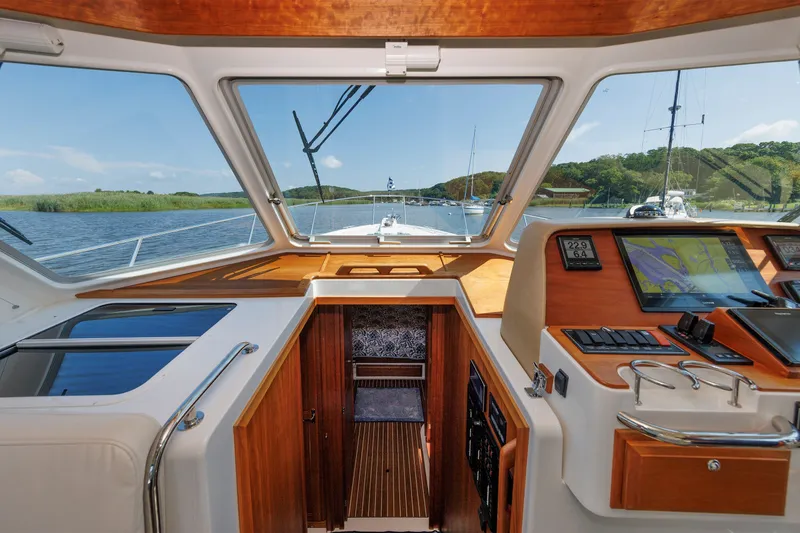 Slide: The Image of Interior view of 2020 Back Cove 41 yacht cockpit with navigation equipment. - 22