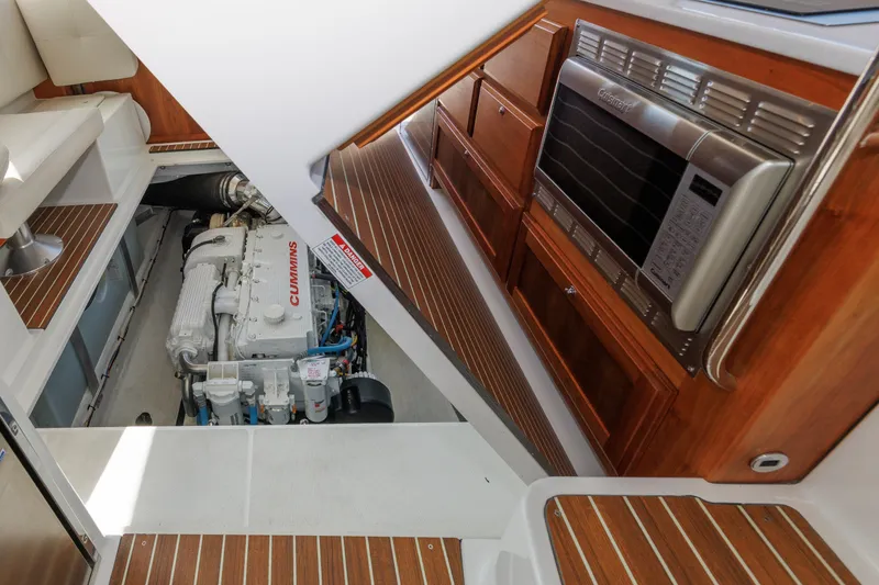 Slide: The Image of 2020 Back Cove 41 yacht interior with Cummins engine and microwave. - 34