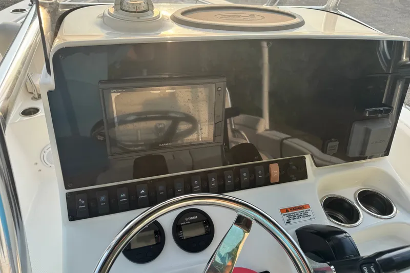 Slide: The Image of Console of a 2020 Sea Hunt Ultra 211 boat with Garmin GPS and Yamaha controls. - 7