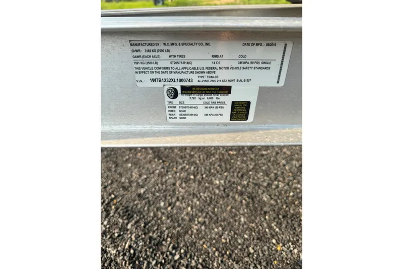 Slide: The Image of Label on Sea Hunt Ultra 211 trailer, detailing specifications and compliance information. - 18