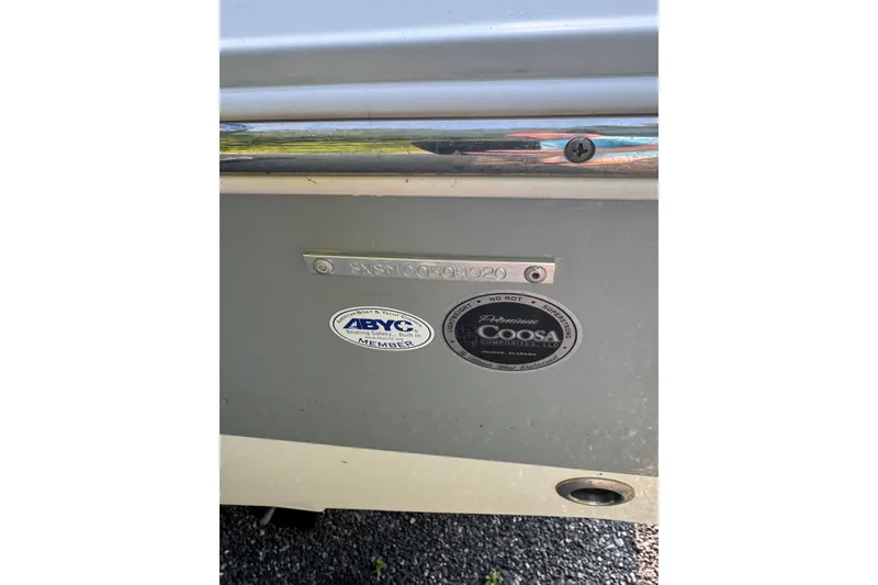 Slide: The Image of 2020 Sea Hunt Ultra 211 boat with ABYC and Coosa certification stickers. - 5