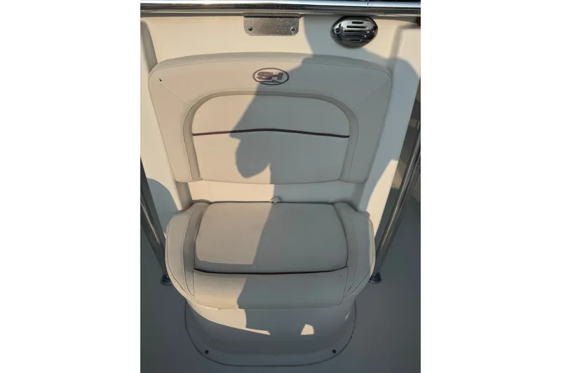 Slide: The Image of 2020 Sea Hunt Ultra 211 boat seat with beige upholstery and integrated speaker. - 11