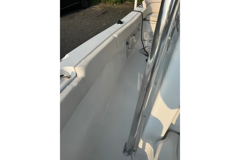 Slide: The Image of Interior view of a 2020 Sea Hunt Ultra 211 boat, showcasing sleek design and seating. - 12