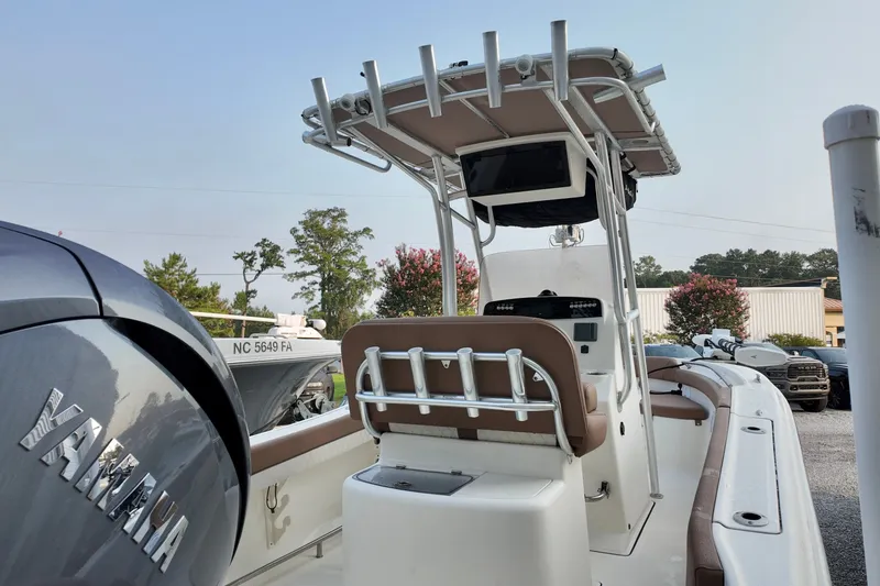 Slide: The Image of 2025 Pioneer 202 Sportfish boat with Yamaha engine, featuring a center console and T-top. - 15
