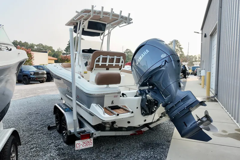 Slide: The Image of 2025 Pioneer 202 Sportfish boat with Yamaha outboard motor on trailer. - 13