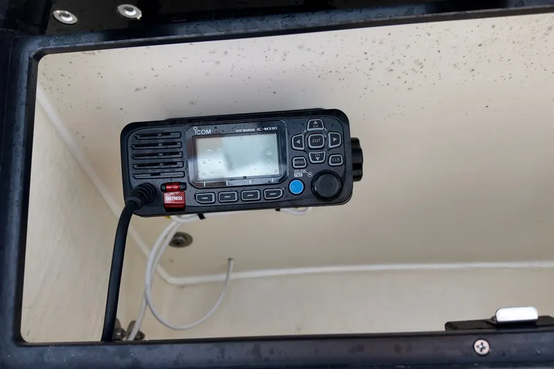 Slide: The Image of VHF marine radio on 2025 Pioneer 202 Sportfish boat dashboard. - 5