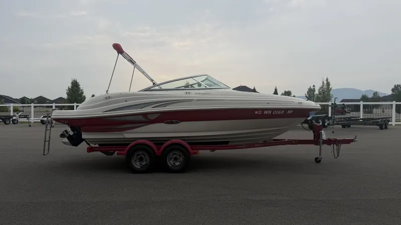 Slide: The Image of A 2004 Sea Ray 200 Sundeck on a trailer, ready for transport. - 3