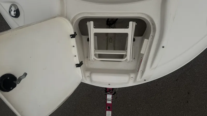 Slide: The Image of An open hatch on a boat reveals a folded ladder. - 21