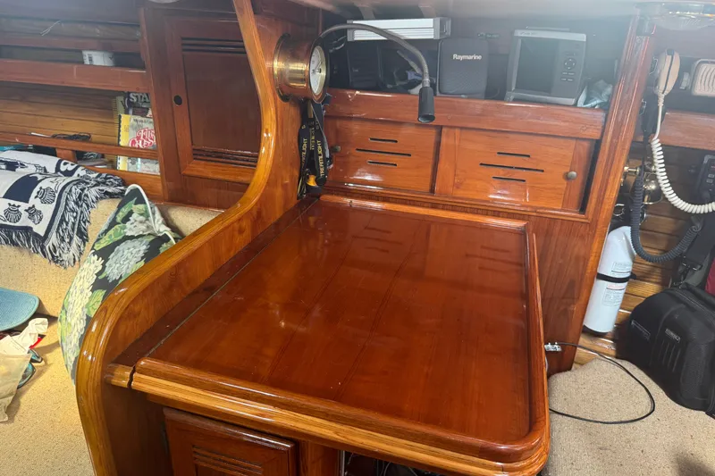 Slide: The Image of Interior of 1986 Cape Dory 36 sailboat with polished wood navigation station. - 6