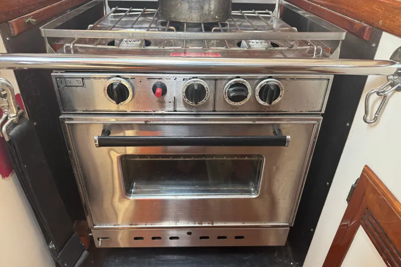 Slide: The Image of Stainless steel stove and oven in a 1986 Cape Dory 36 yacht galley. - 5