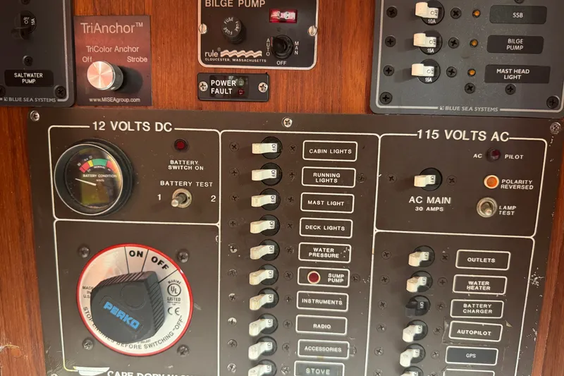 Slide: The Image of Electrical control panel of a 1986 Cape Dory 36 sailboat, featuring switches and gauges. - 7