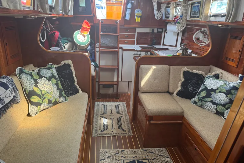 Slide: The Image of Interior of a 1986 Cape Dory 36 sailboat with cozy seating and nautical decor. - 3