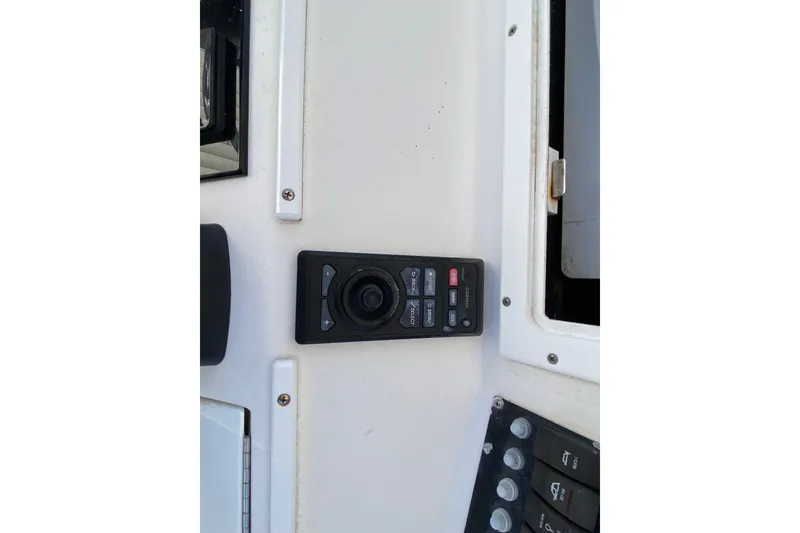 Slide: The Image of Control panel on a 2006 Regulator 23 Forward Seating boat dashboard. - 13