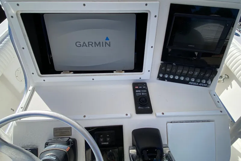 Slide: The Image of 2006 Regulator 23 Forward Seating boat dashboard with Garmin navigation system. - 10