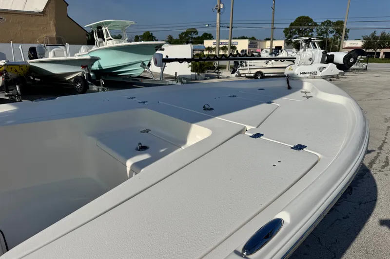 Slide: The Image of 2020 Key West 210 Bay Reef boat with Minn Kota trolling motor in a dealership lot. - 19