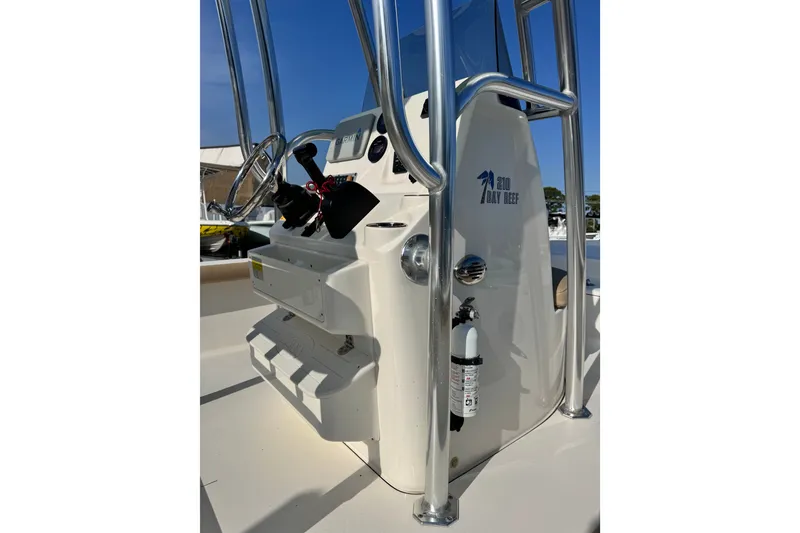 Slide: The Image of 2020 Key West 210 Bay Reef boat console with steering wheel and safety equipment. - 21