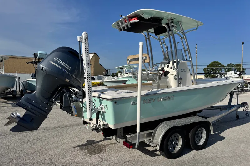 Slide: The Image of 2020 Key West 210 Bay Reef boat with Yamaha outboard engine on a trailer. - 16