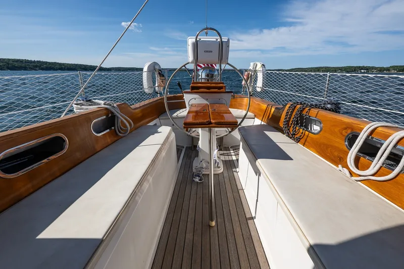 Slide: The Image of Hinckley Sou'wester 42 MKII sailboat cockpit, 1995 model, featuring wooden accents and ocean view. - 37