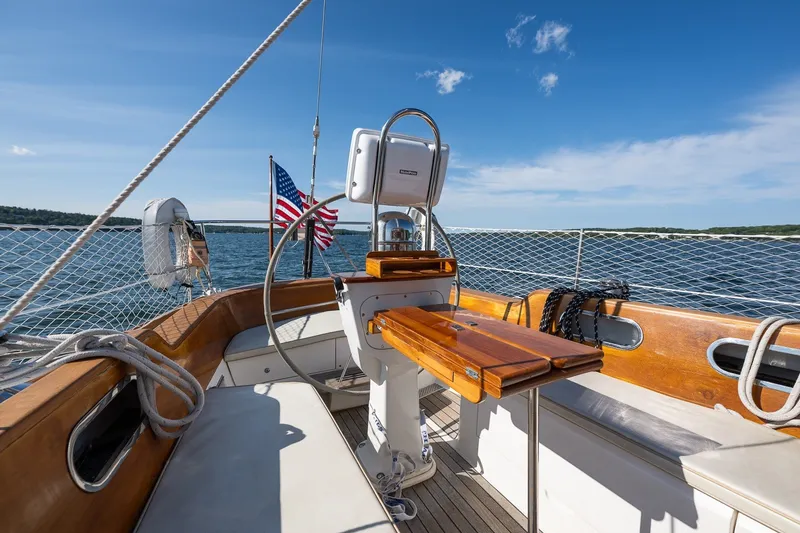 Slide: The Image of Cockpit of 1995 Hinckley Sou'wester 42 MKII sailboat with American flag, on open water. - 57