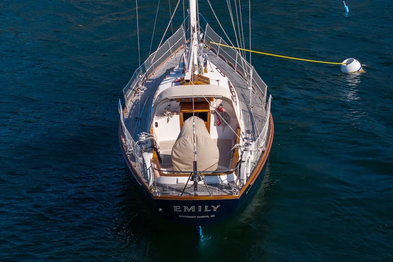 Slide: The Image of Hinckley Sou'wester 42 MKII sailboat, 1995 model, moored on calm blue water. - 9