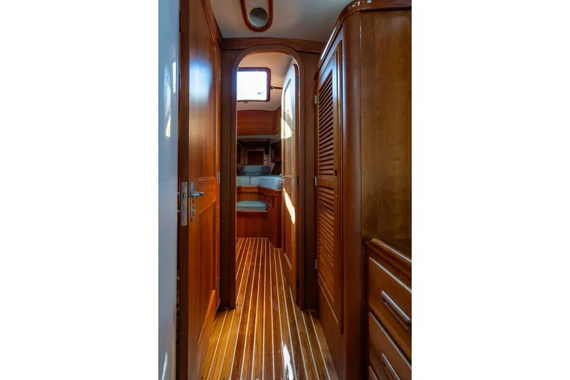 Slide: The Image of Interior of 1995 Hinckley Sou'wester 42 MKII yacht, featuring polished wood finishes. - 27