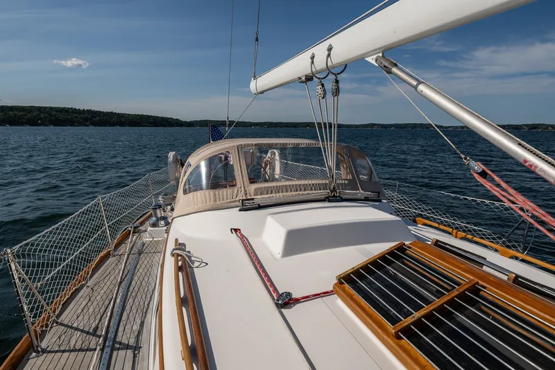 Slide: The Image of Hinckley Sou'wester 42 MKII sailboat on open water, showcasing deck and rigging, 1995 model. - 54