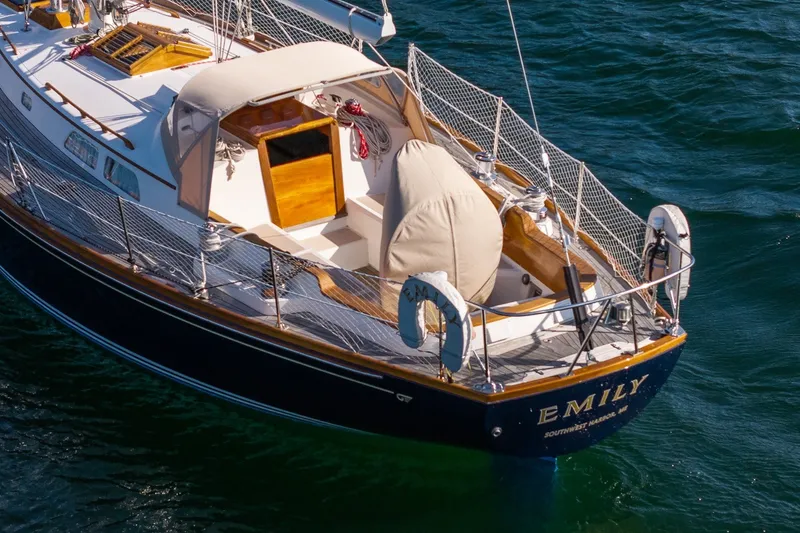 Slide: The Image of Hinckley Sou'wester 42 MKII sailboat, 1995, named "Emily" on the water. - 4