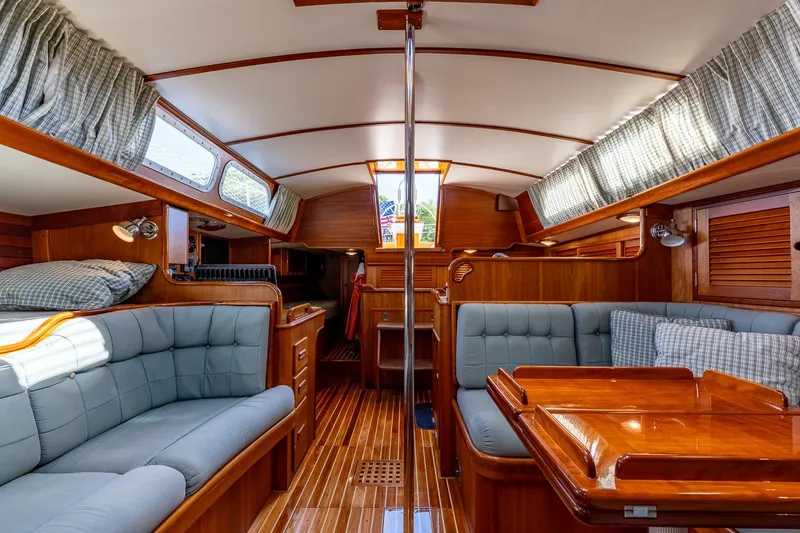 Slide: The Image of Interior of 1995 Hinckley Sou'wester 42 MKII sailboat with elegant wood finish and cozy seating. - 28