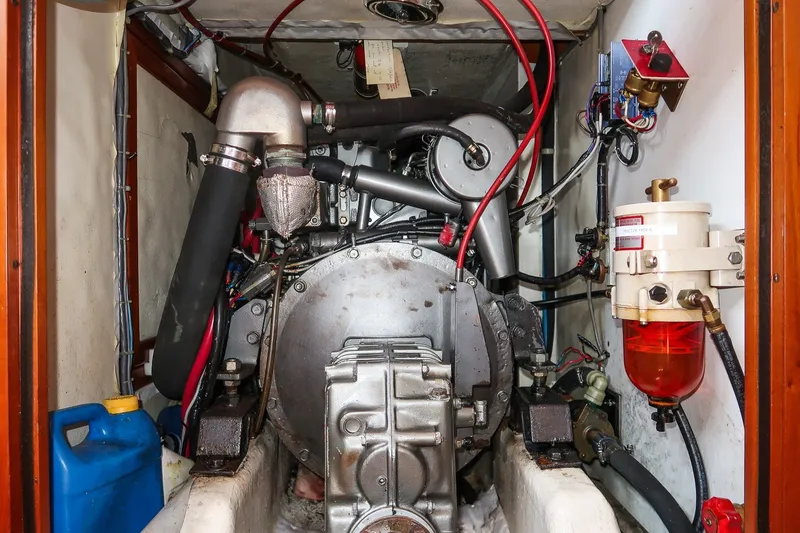Slide: The Image of Engine compartment of a 1995 Hinckley Sou'wester 42 MKII sailboat, showcasing mechanical components. - 66