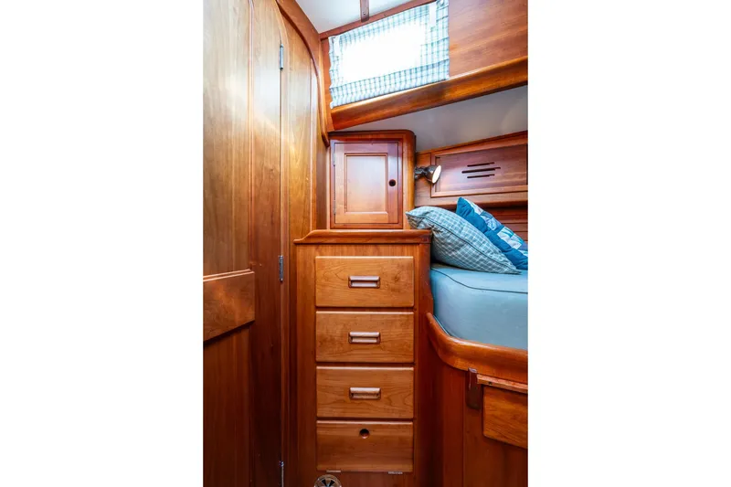 Slide: The Image of Hinckley Sou'wester 42 MKII 1995 cabin interior with wooden drawers and bed. - 32
