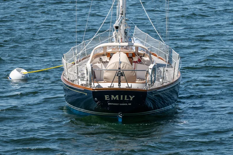 Slide: The Image of Hinckley Sou'wester 42 MKII sailboat, 1995, named "Emily" on calm water. - 10