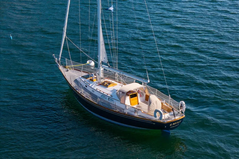 Slide: The Image of Hinckley Sou'wester 42 MKII sailboat from 1995 on calm blue waters. - 3