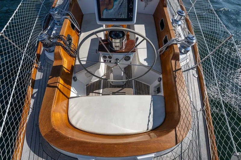 Slide: The Image of Cockpit of 1995 Hinckley Sou'wester 42 MKII sailboat with wooden trim and steering wheel. - 58
