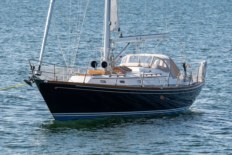 Slide: The Image of Hinckley Sou'wester 42 MKII sailboat from 1995 on calm water. - 68