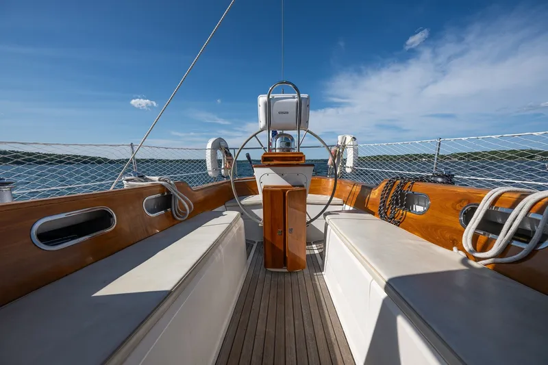 Slide: The Image of Cockpit of 1995 Hinckley Sou'wester 42 MKII sailboat with wooden accents and ocean view. - 36