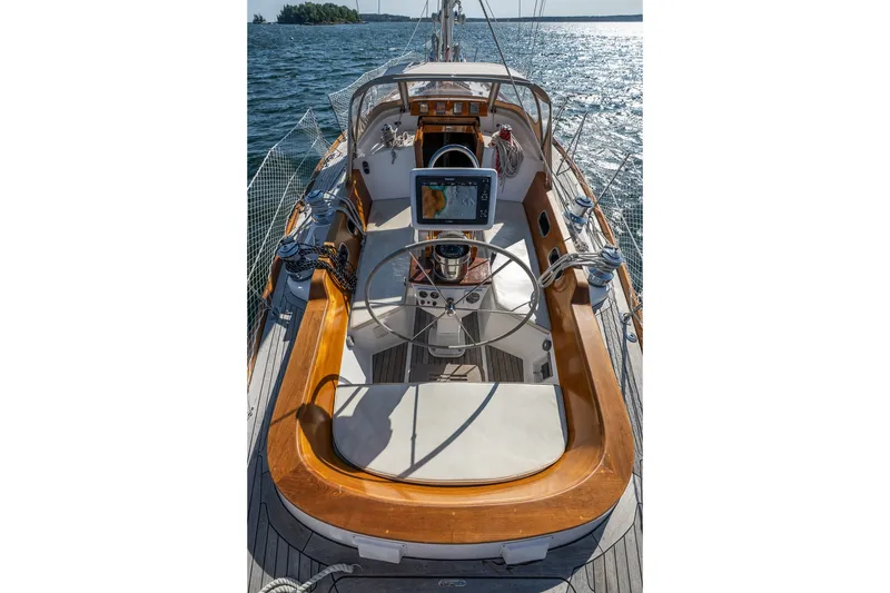 Slide: The Image of Cockpit of 1995 Hinckley Sou'wester 42 MKII sailboat with wooden trim and navigation equipment. - 42