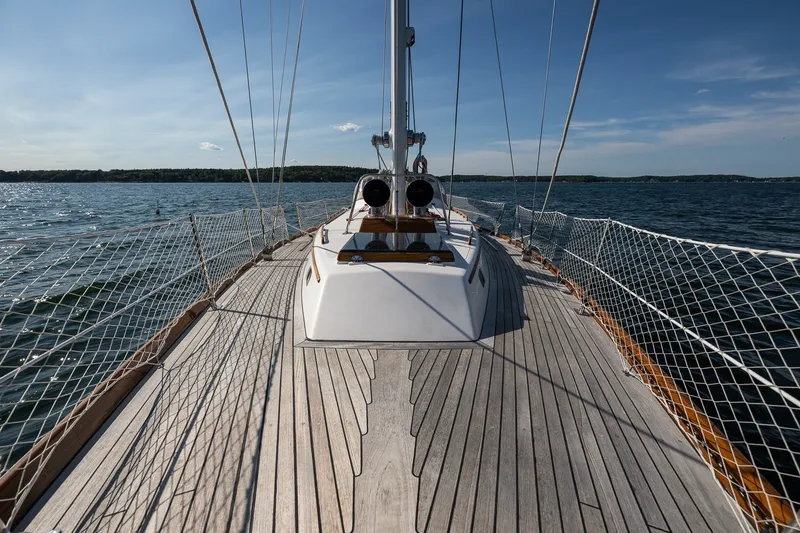 Slide: The Image of Hinckley Sou'wester 42 MKII sailboat deck, 1995 model, cruising on open water under clear skies. - 51