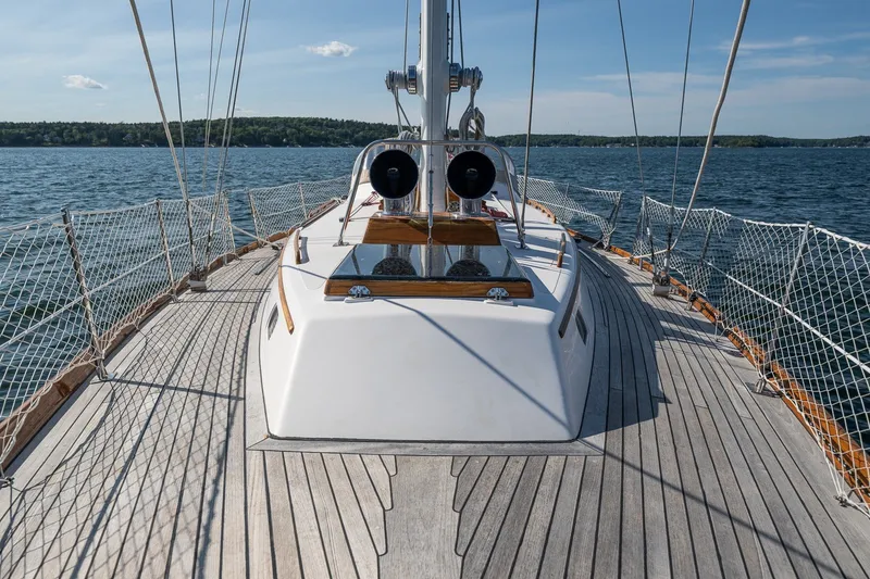 Slide: The Image of Hinckley Sou'wester 42 MKII sailboat deck, 1995 model, on calm waters under clear skies. - 52