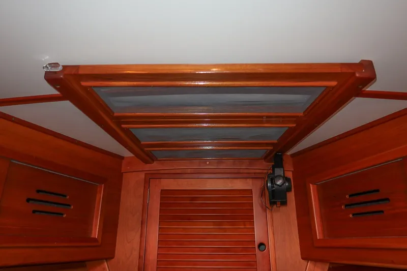Slide: The Image of Interior view of 1995 Hinckley Sou'wester 42 MKII sailboat with wooden hatch and fan. - 65