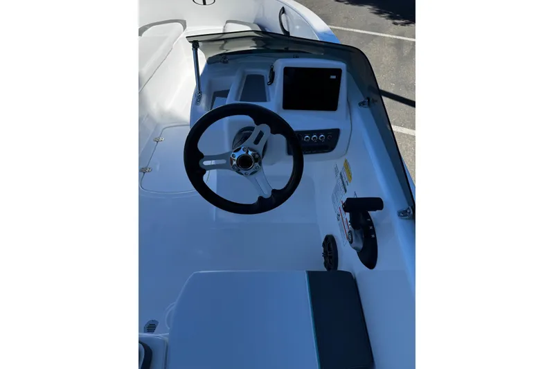 Slide: The Image of 2026 Tahoe T16 boat cockpit with steering wheel and control panel. - 9