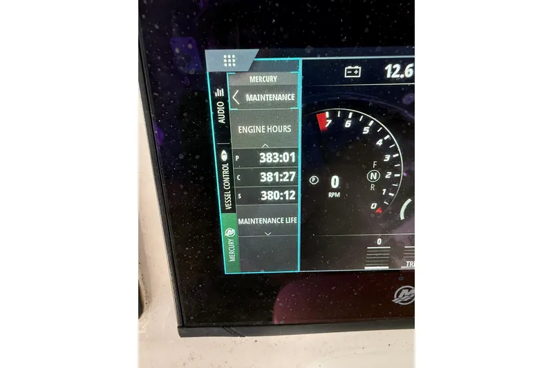 Slide: The Image of Display screen showing engine hours on a 2020 Intrepid 407 Cuddy boat. - 14