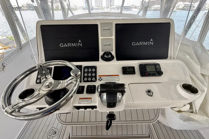 Slide: The Image of Helm of 2020 Intrepid 407 Cuddy with Garmin navigation displays and controls. - 13