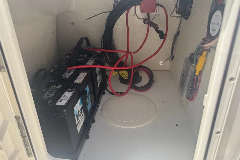 Slide: The Image of Battery compartment of 2027 Key West 1720 Center Console boat with wiring. - 13