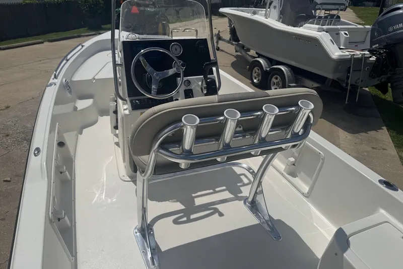 Slide: The Image of 2027 Key West 1720 Center Console boat interior with steering wheel and rod holders. - 9