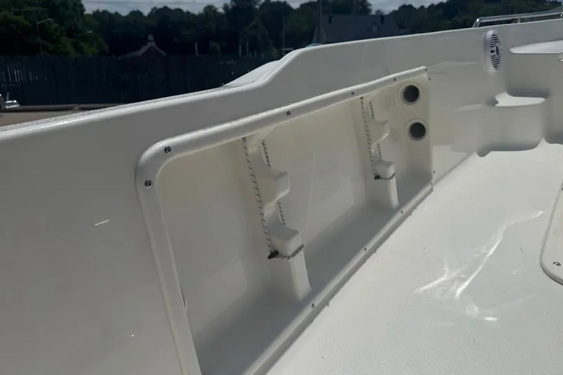 Slide: The Image of Interior view of a 2027 Key West 1720 Center Console boat, showcasing storage compartments. - 19