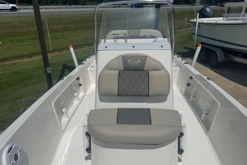 Slide: The Image of 2027 Key West 1720 Center Console boat interior with cushioned seating and console view. - 20