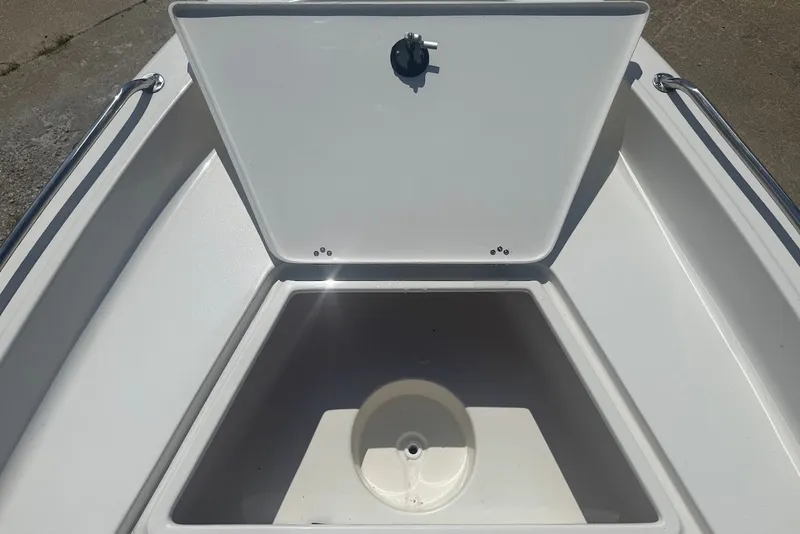 Slide: The Image of 2027 Key West 1720 Center Console boat storage compartment with open hatch. - 14