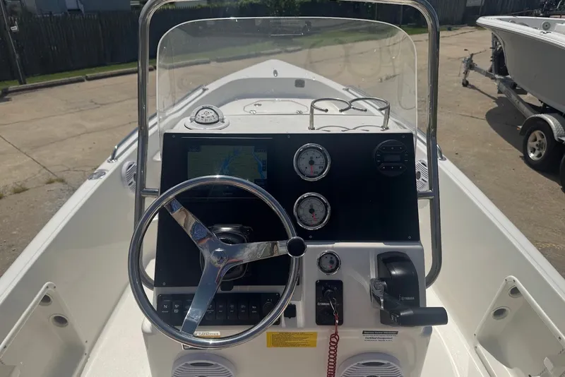 Slide: The Image of 2027 Key West 1720 Center Console boat dashboard with steering wheel and gauges. - 12